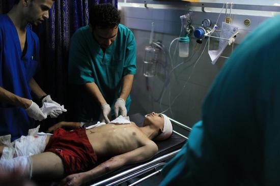 Не менее 75 палестинцев и 13 израильтян были убиты на протяжении только одной ночи в районе Шуджайя.